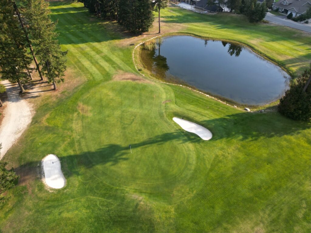 Aerial view of hole 1 at Kahler Mountain Club, a par 4 of 372 yards from the blue tees.